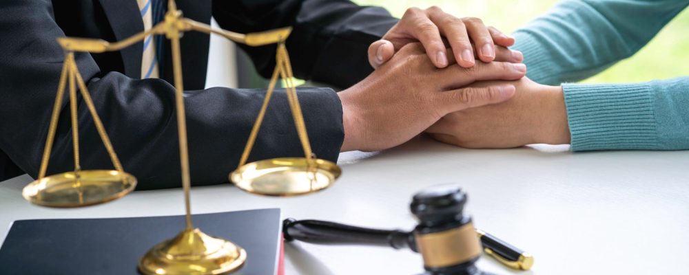 Male lawyer discussing legal cases with clients and encourage Make an appointment with courtroom contact documents, law and the concept of justice, justice.